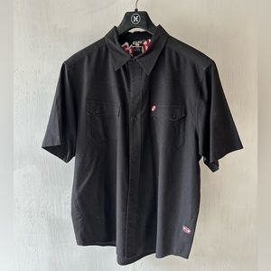 Split short sleeve black button up shirt. Size Large.